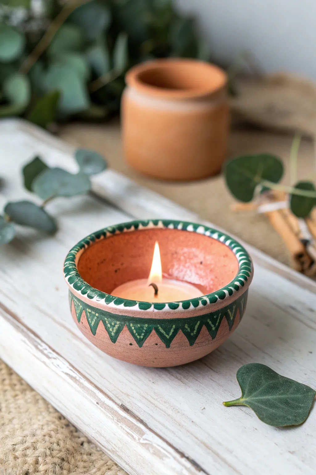 Matte blush diya with glossy emerald drip rim for an easy faux enamel, modern boho look.
