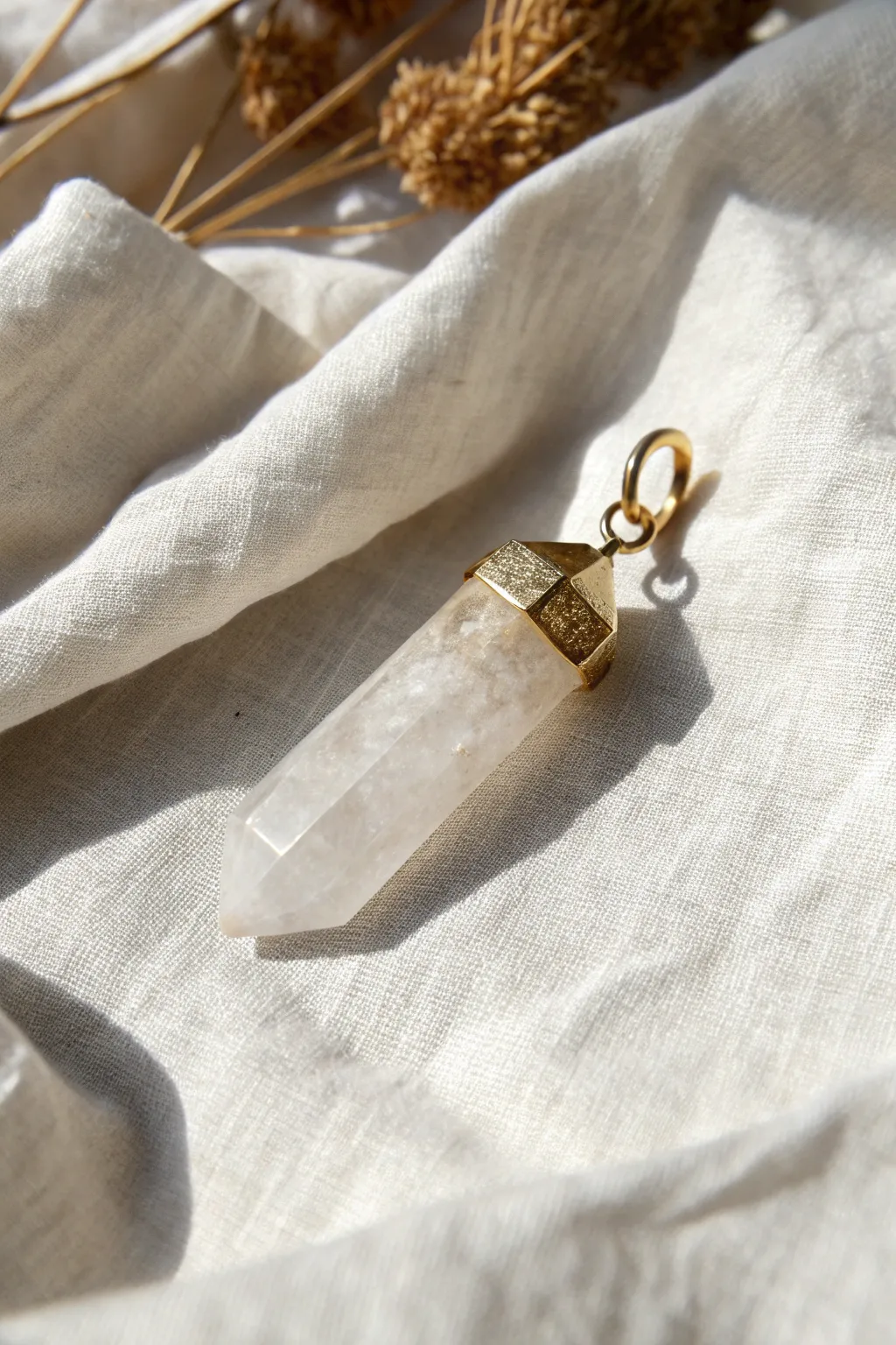 Raw quartz pendant with a smooth epoxy clay cap, minimalist and handmade with natural contrast