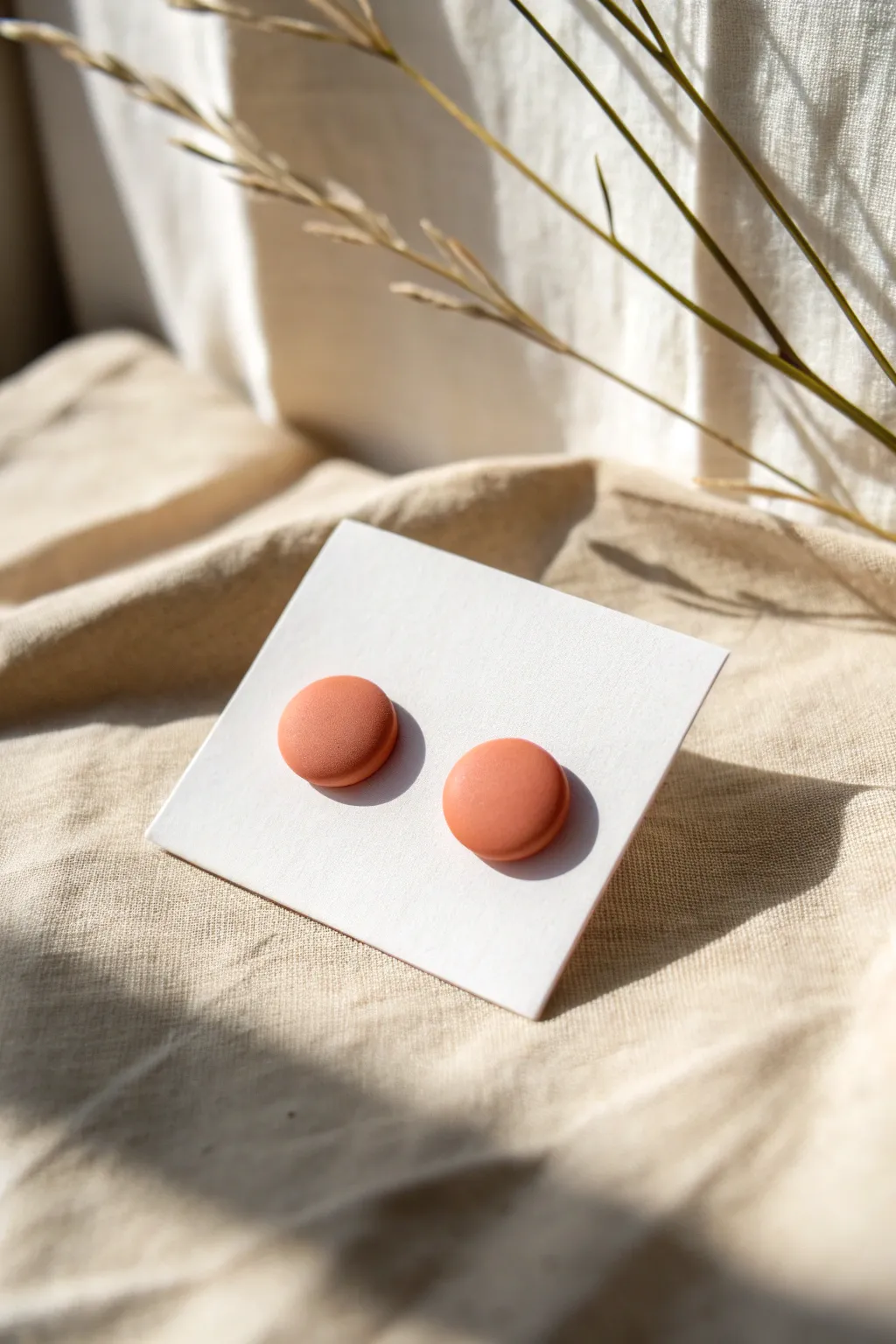 Matte meets shine: minimalist polymer clay studs with a glossy dip for a soft statement
