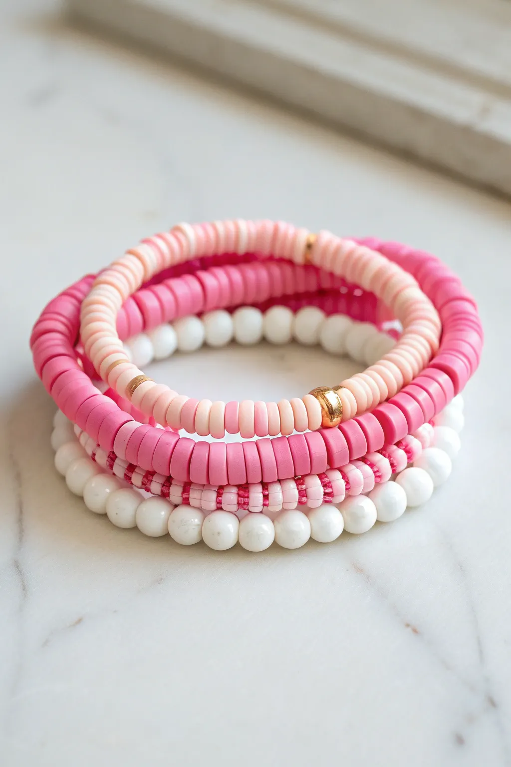 Pink prep heishi bracelet stack with pearly white accents, simple, chic, handmade vibes.