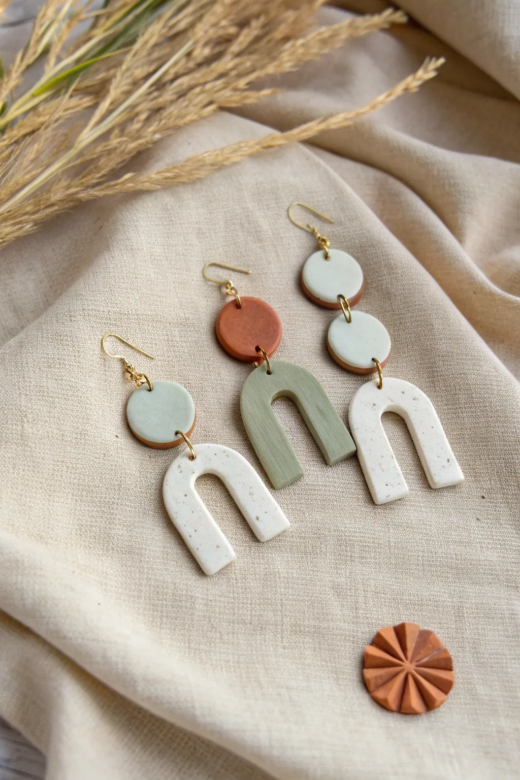 Easy air-dry clay statement earrings in arches and circles with a chic half-dip paint finish