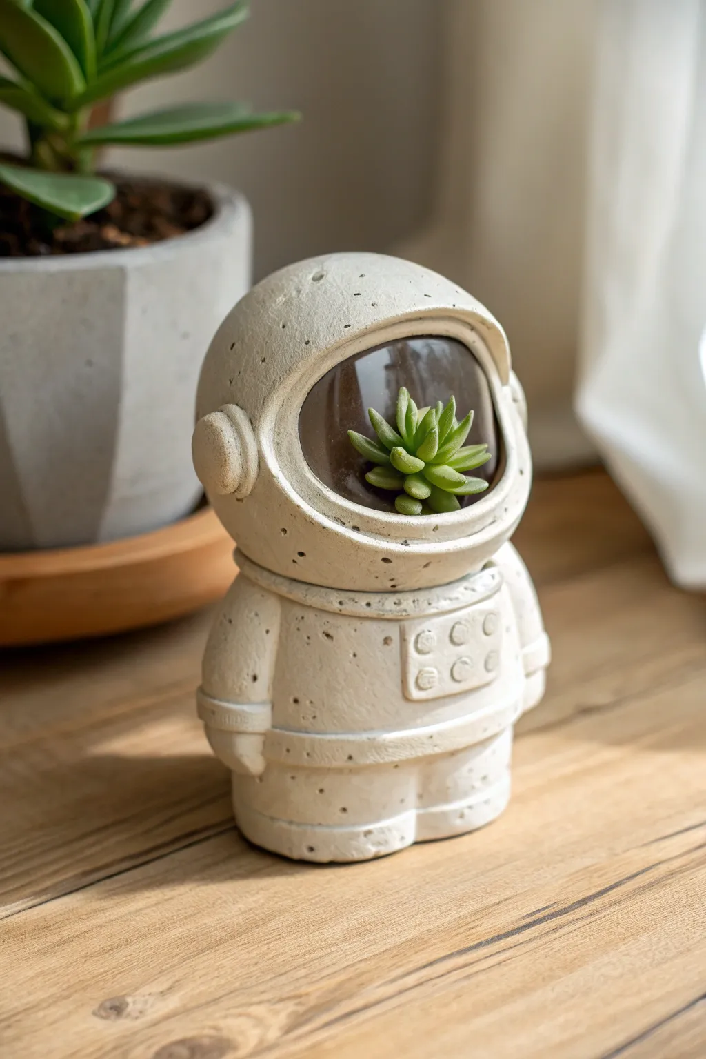 Mini astronaut helmet planter with a tiny succulent, minimalist clay charm with cozy Nordic vibes