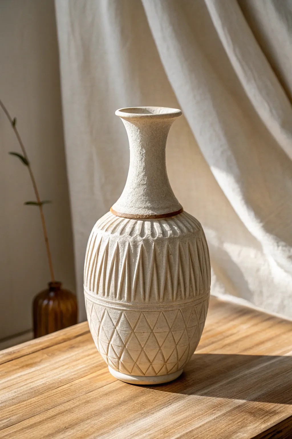 Fluted meets faceted: a minimalist thrown vase where side light reveals every crisp shadow.