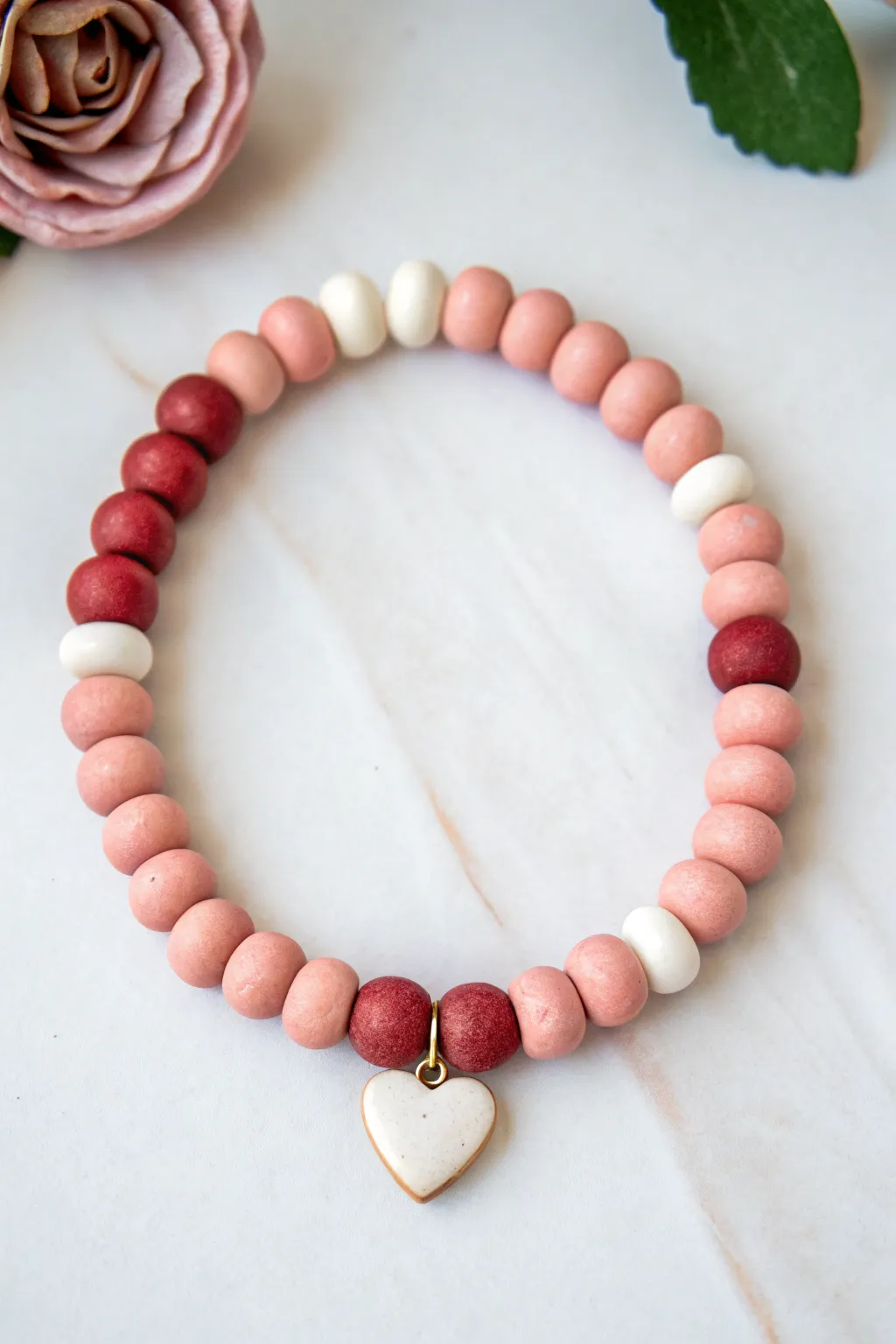 Half-and-half Valentine clay bracelet with a tiny heart center, simple, sweet, handmade.