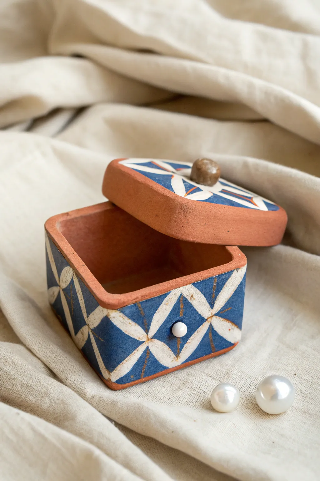 Tiny air dry clay trinket box with a bold painted lid, perfect for a sweet birthday keepsake.