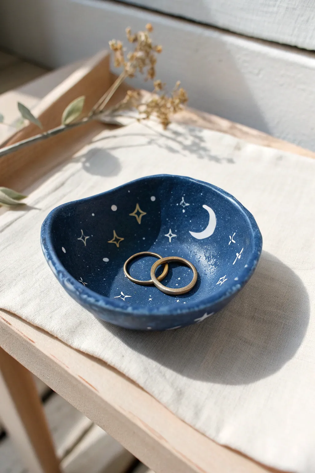 Midnight blue moon-and-stars trinket dish—simple polymer clay charm for rings and keepsakes.