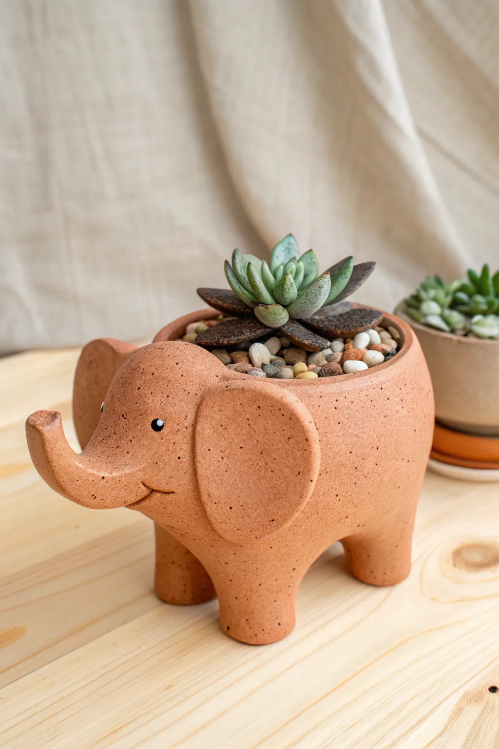 Simple clay elephant planter bowl with a tiny succulent for a chic minimalist boho look