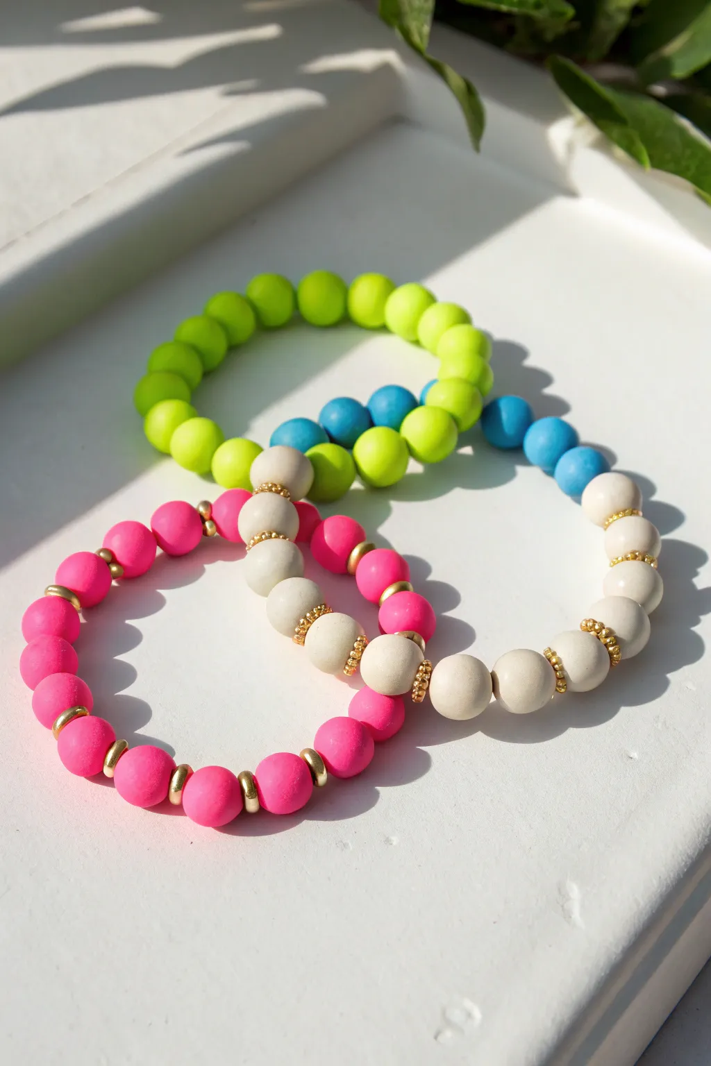 Neon pop clay bead bracelet paired with a creamy neutral reset for a clean, balanced vibe.