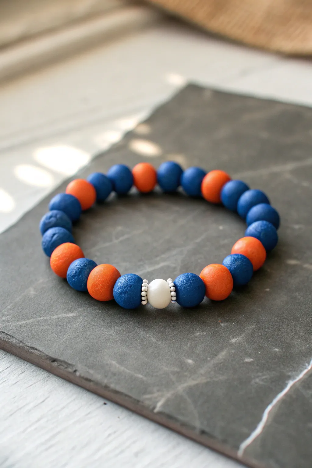 Two-tone opposites: cobalt blue and burnt orange clay beads with crisp white for contrast.