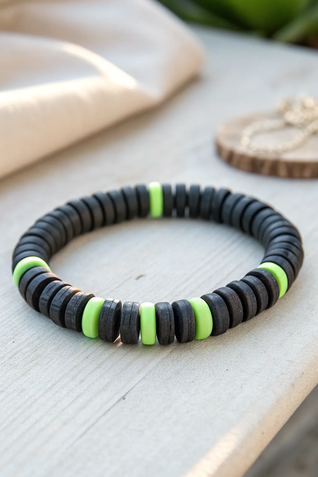 Matte black clay bracelet with a neon glow strip, minimalist and easy to recreate at home.