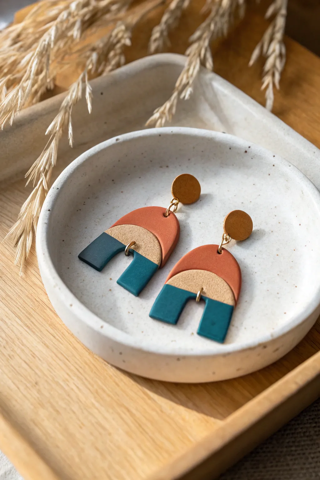 Mixed matte and glossy clay earrings in bold terracotta and teal, simple and beginner friendly.