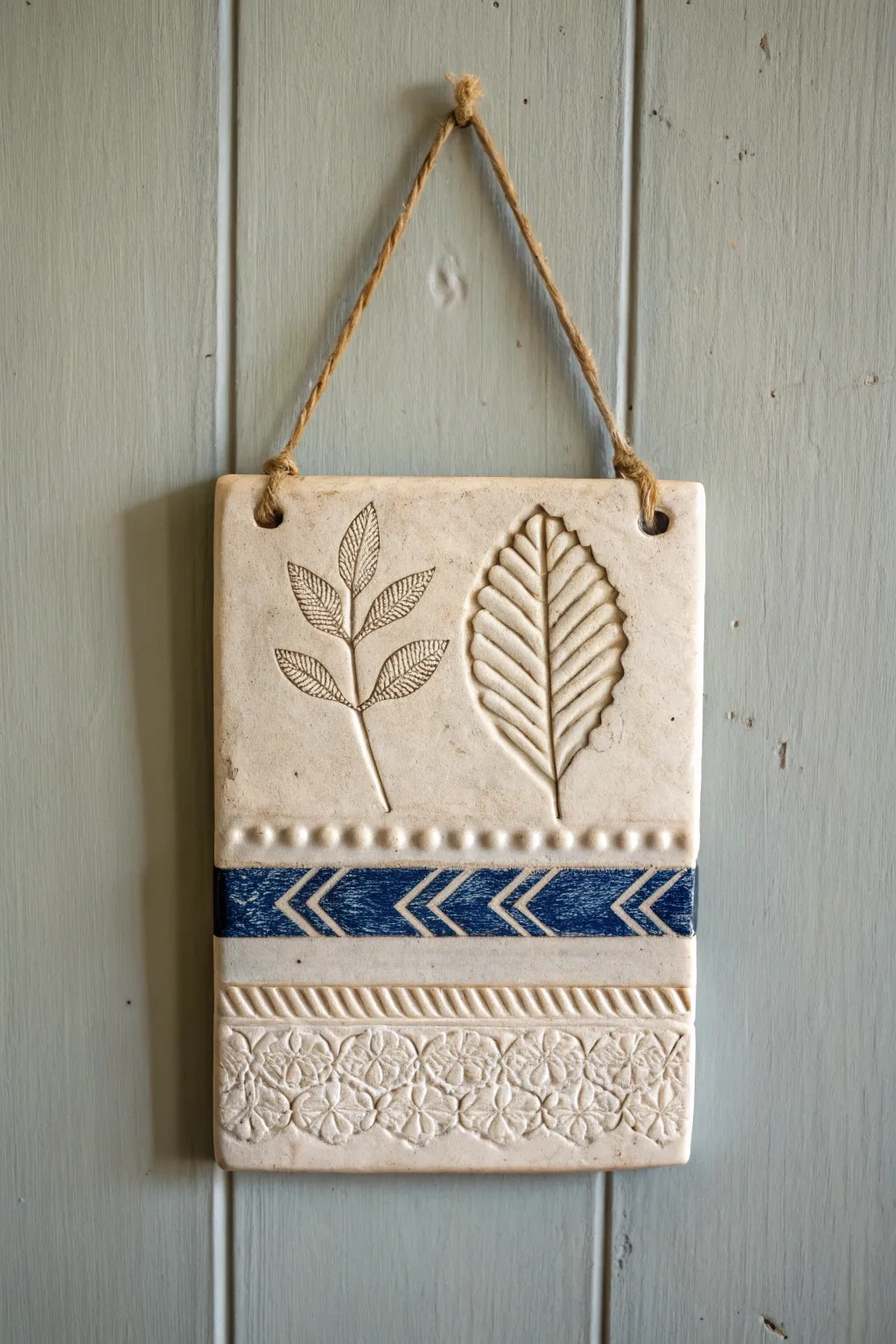 Beginner texture tile with lines, lace, and leaf imprints, a simple wall-hanging you can make.
