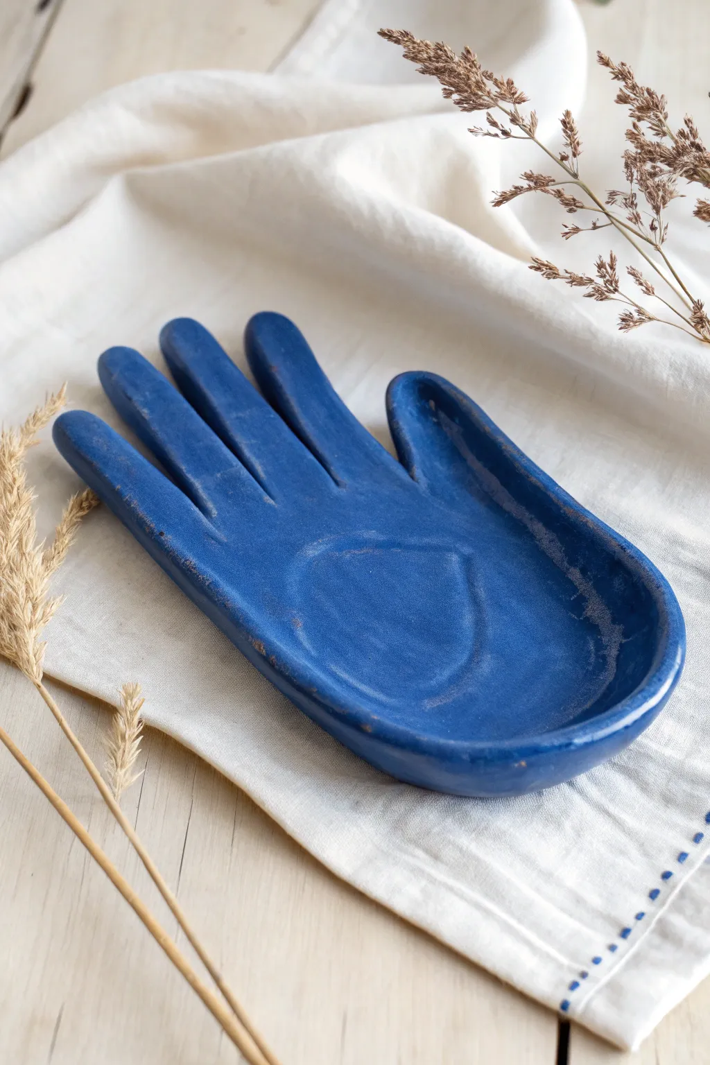 Sculptural hand clay rolling tray with smooth palm and finger rim, finished in bold matte glaze.