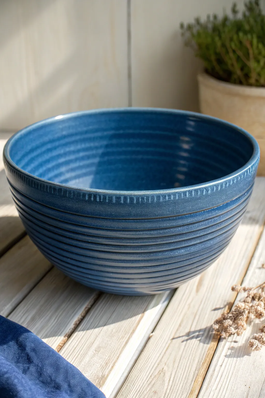 Bold ribbed rings transform a simple wheel-thrown bowl into a modern, tactile statement piece.