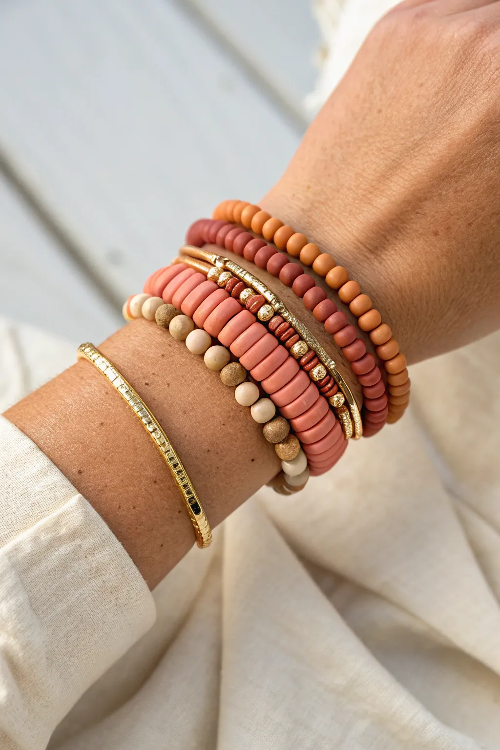 Mixed-shape clay bracelet stack with heishi discs plus tube and nugget beads for texture.