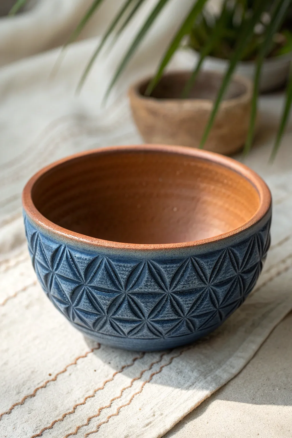 Crisp carved triangles turn a simple pinch pot into a bold, modern statement with handmade texture.