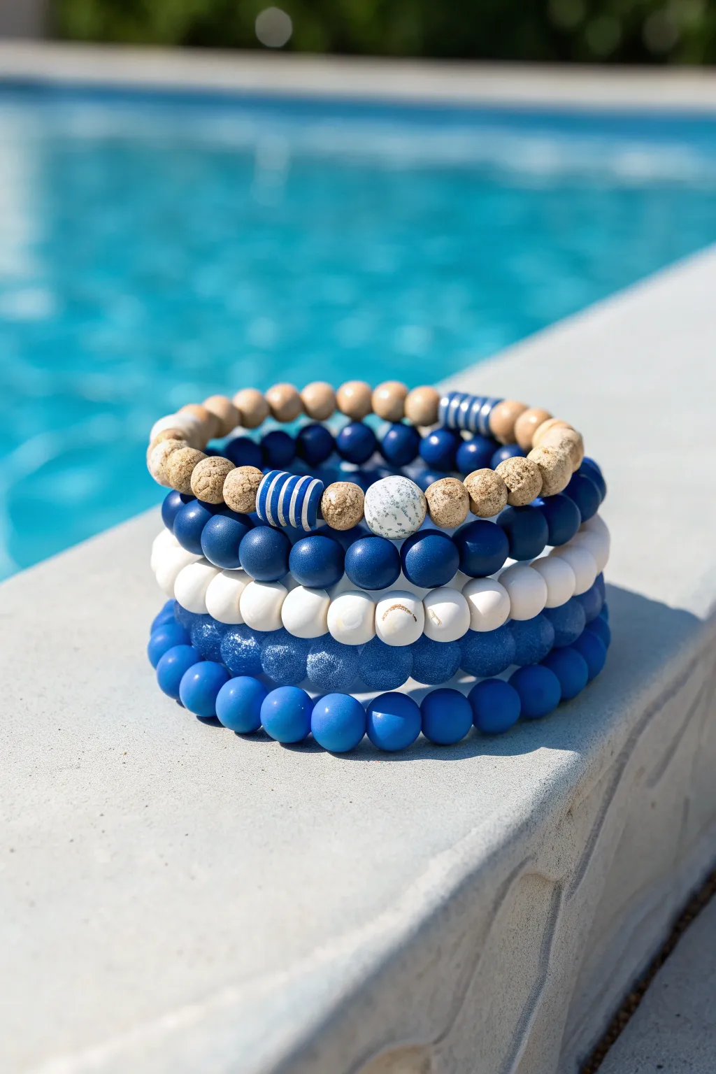 Mismatched blues mega-stack of clay bead bracelets with matte, glossy, and ribbed textures
