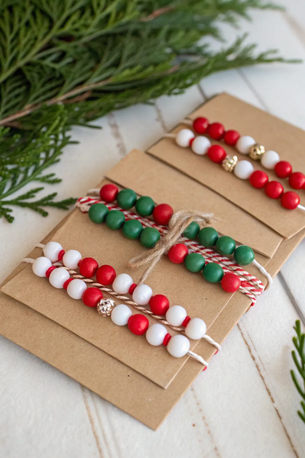 Gift-ready Christmas clay bead bracelets on kraft cards, a sweet and simple stocking stuffer idea