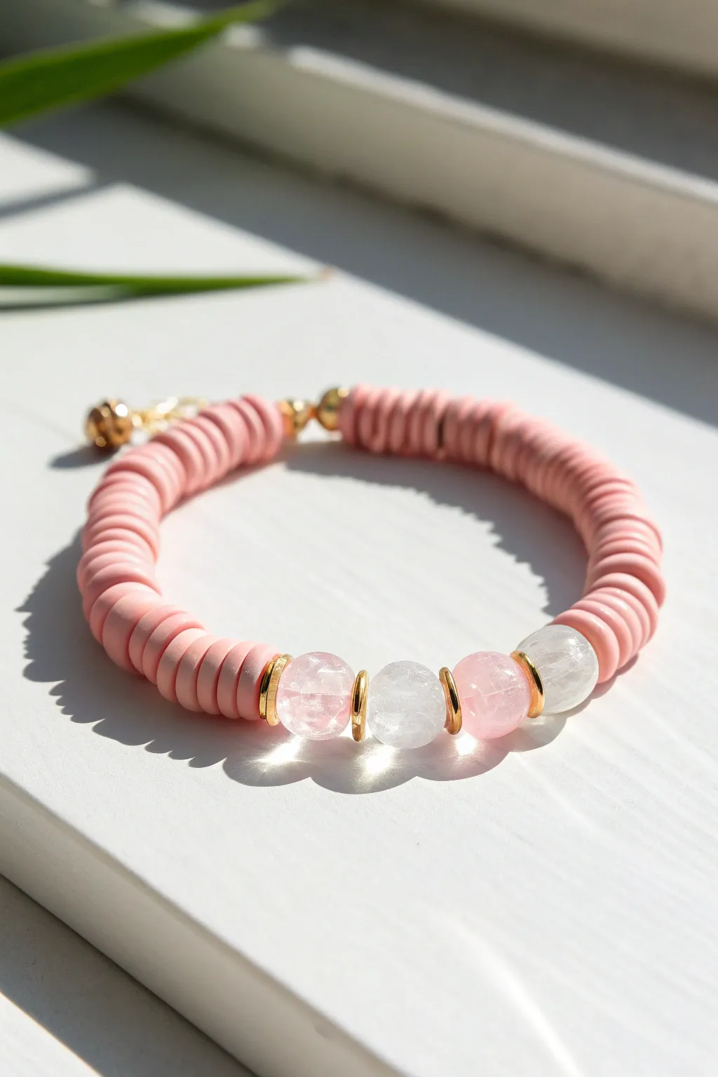 Pink clay disc beads with clear jelly spacers for an airy, minimalist bracelet pop