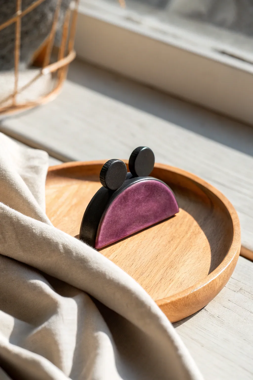 Bold mouse-ear clay hair clip with curved horns in black and purple, minimalist boho style