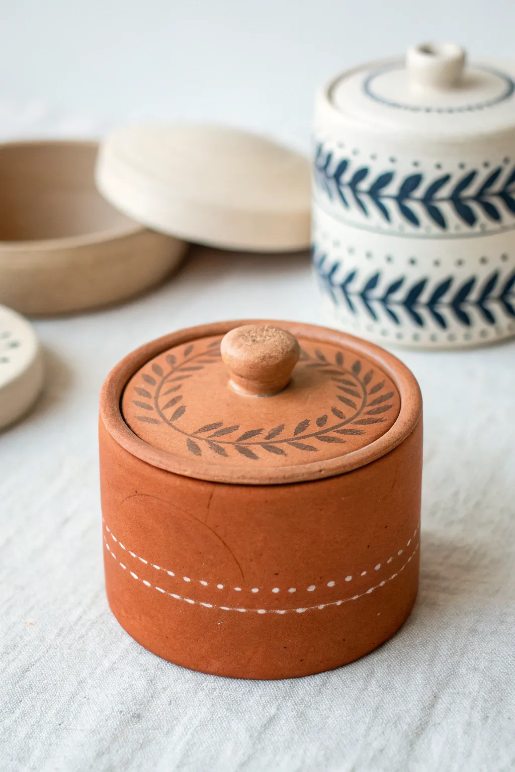 Tiny clay keepsake box with two lids, simple shapes, bold color accents for a sweet date craft.