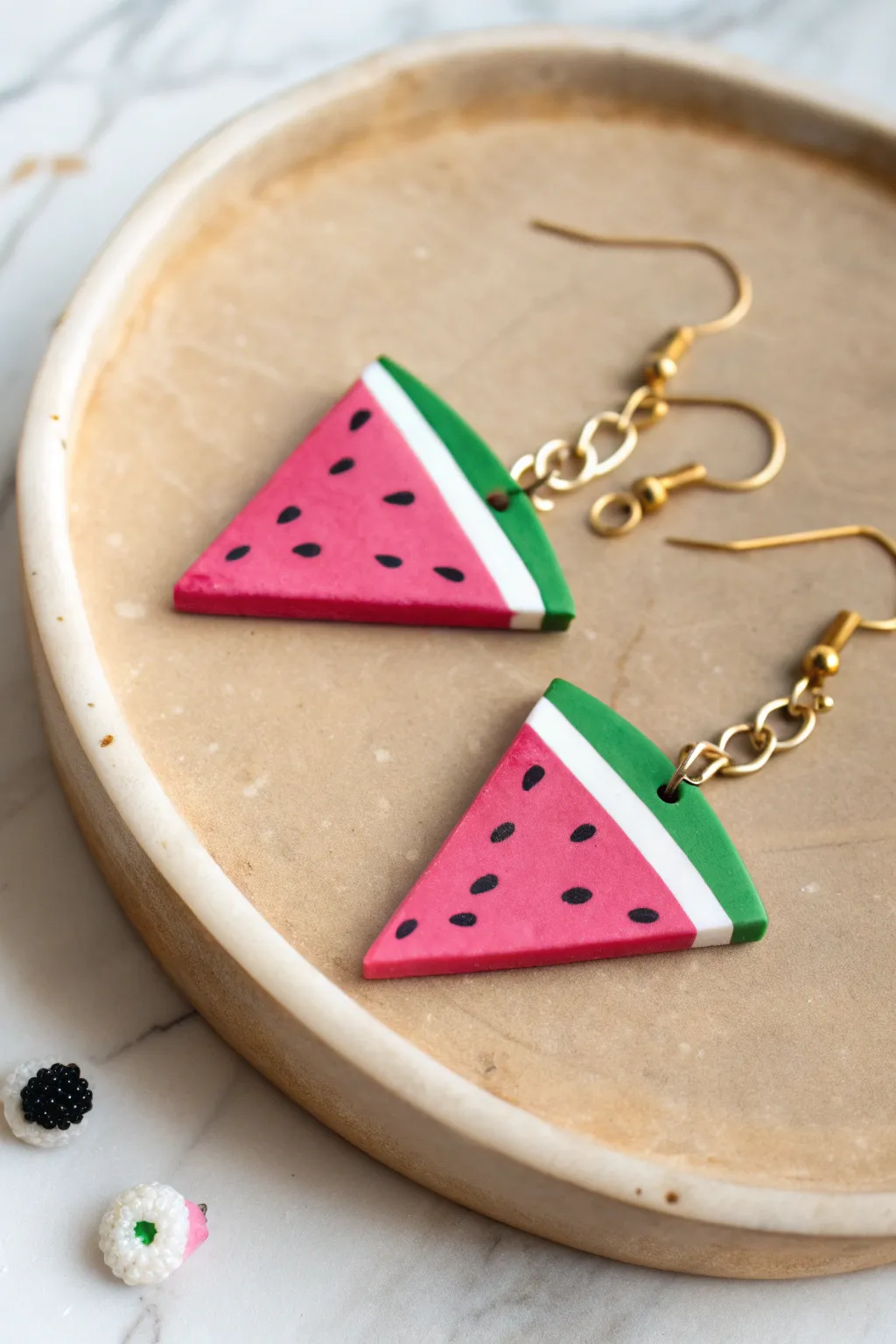 Playful watermelon wedge clay earrings in bold summer colors, minimalist and handmade.