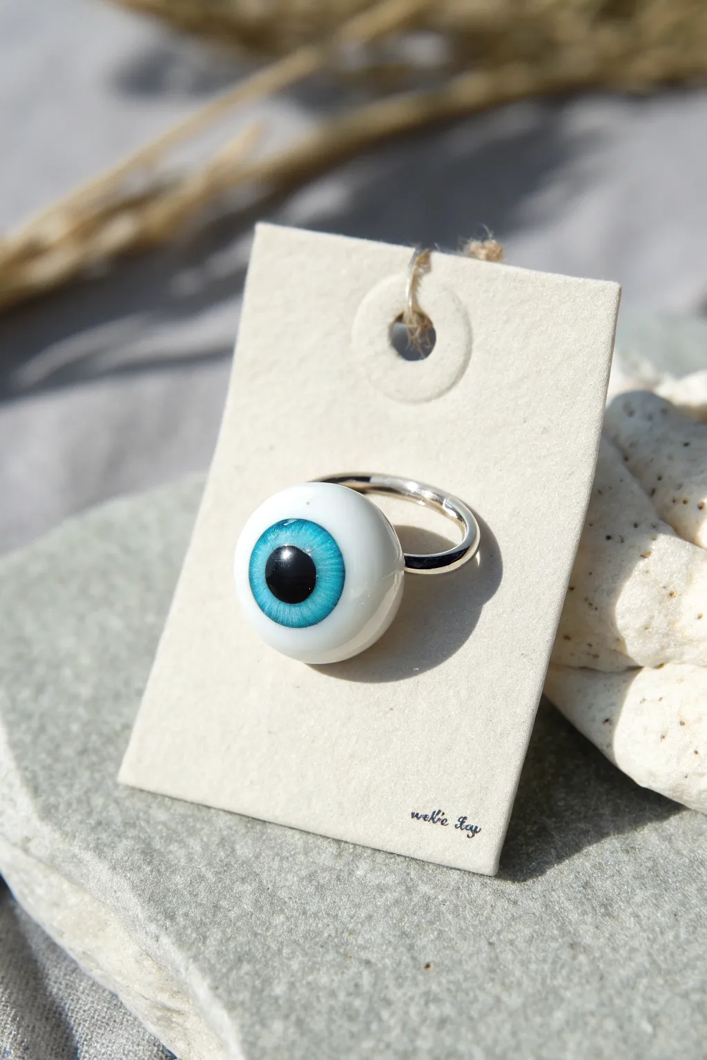 Glossy polymer clay eyeball ring charm with bold turquoise iris, minimalist boho Halloween style