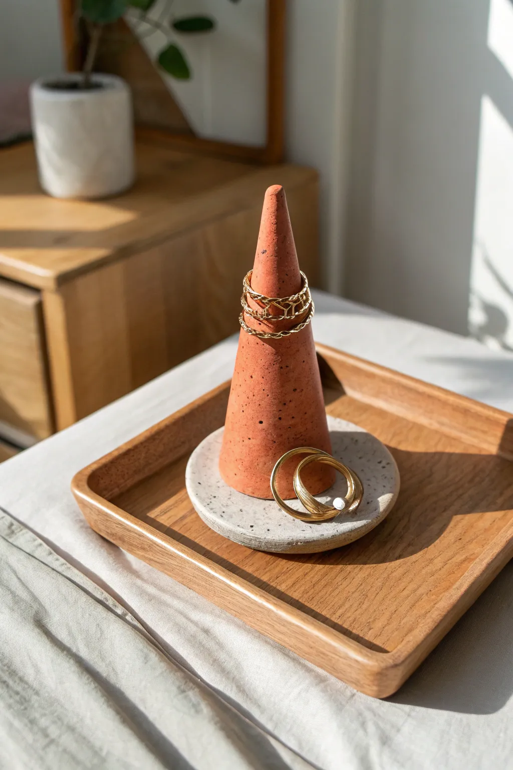 A chic ring cone that keeps your favorite rings safe, stacked, and easy to grab at night.