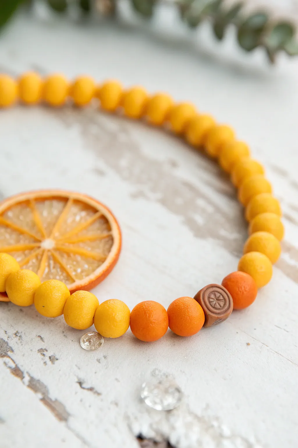 Half lemon, half orange: a bold citrus color block clay bead bracelet with fruit slice accents