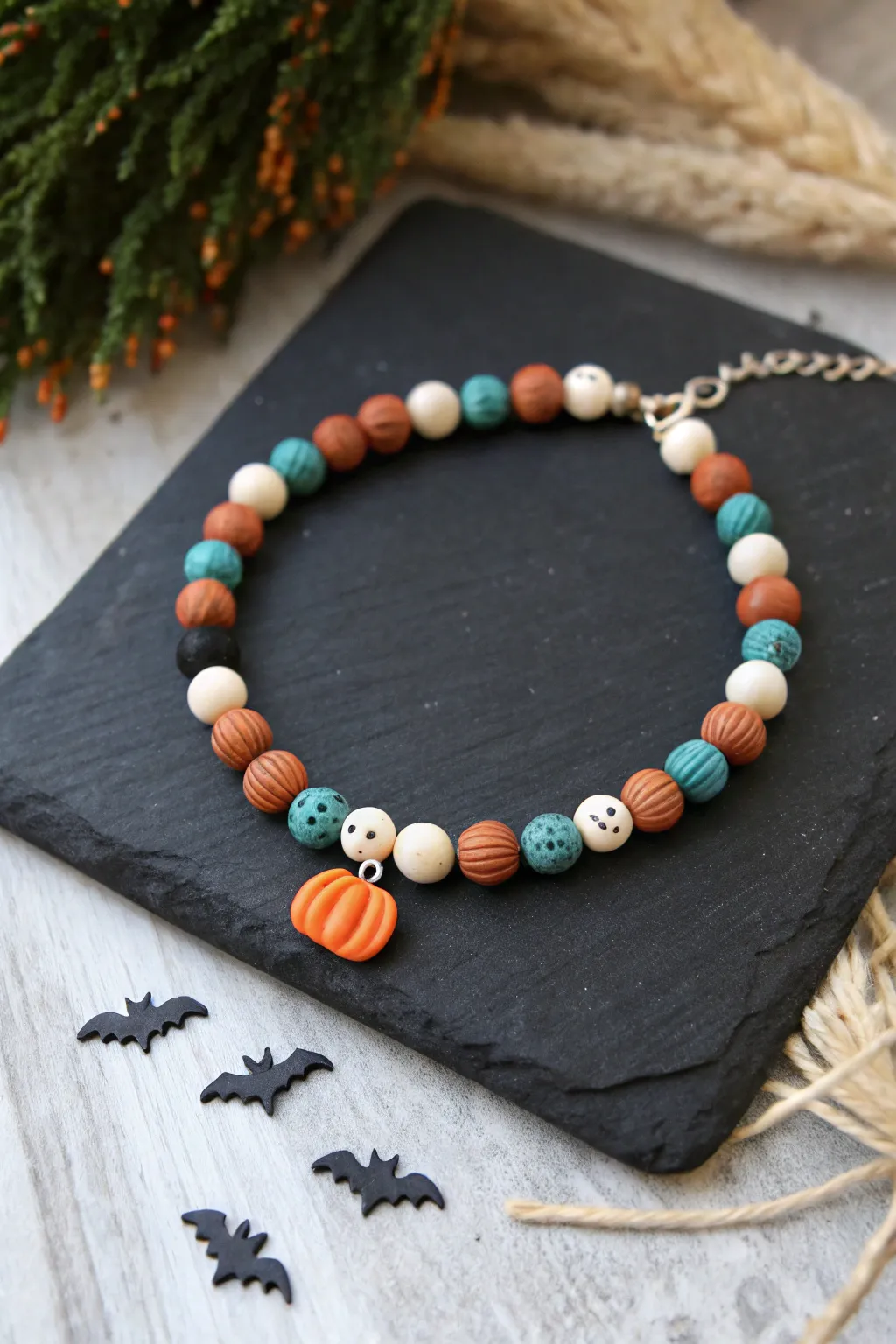 Mini polymer clay charm beads turn a simple bracelet into spooky-cute Halloween style.