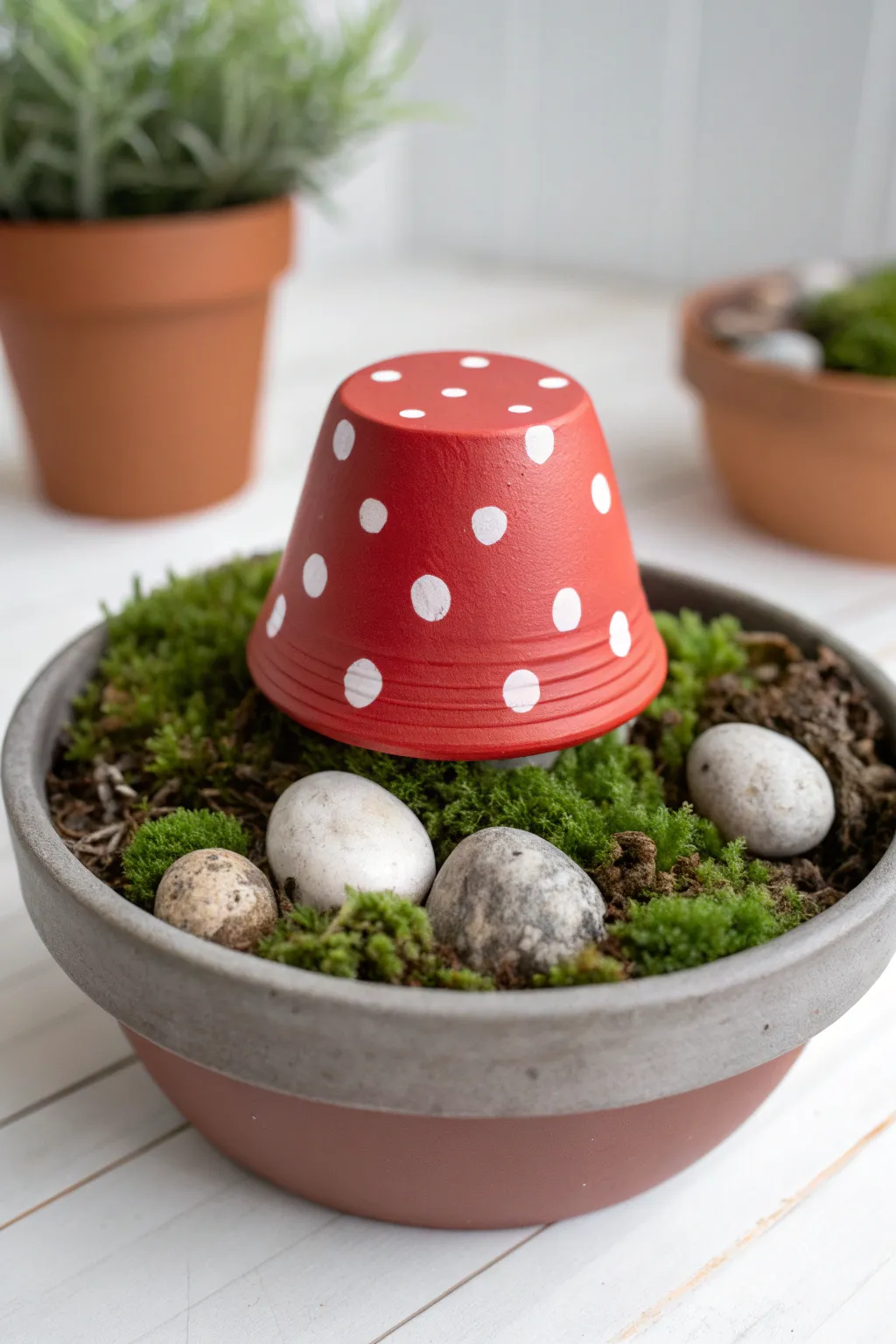 Turn a mini clay pot and saucer into a cute red mushroom accent for a simple fairy garden.