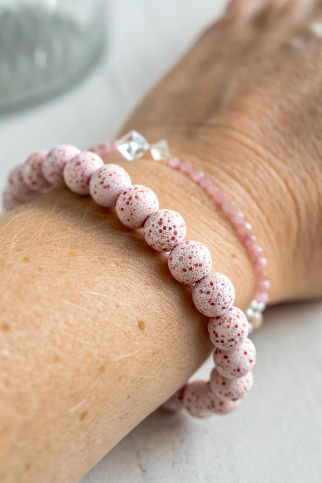 Pink sprinkle speckled bead bracelet for a playful pop of color in a clean minimalist look