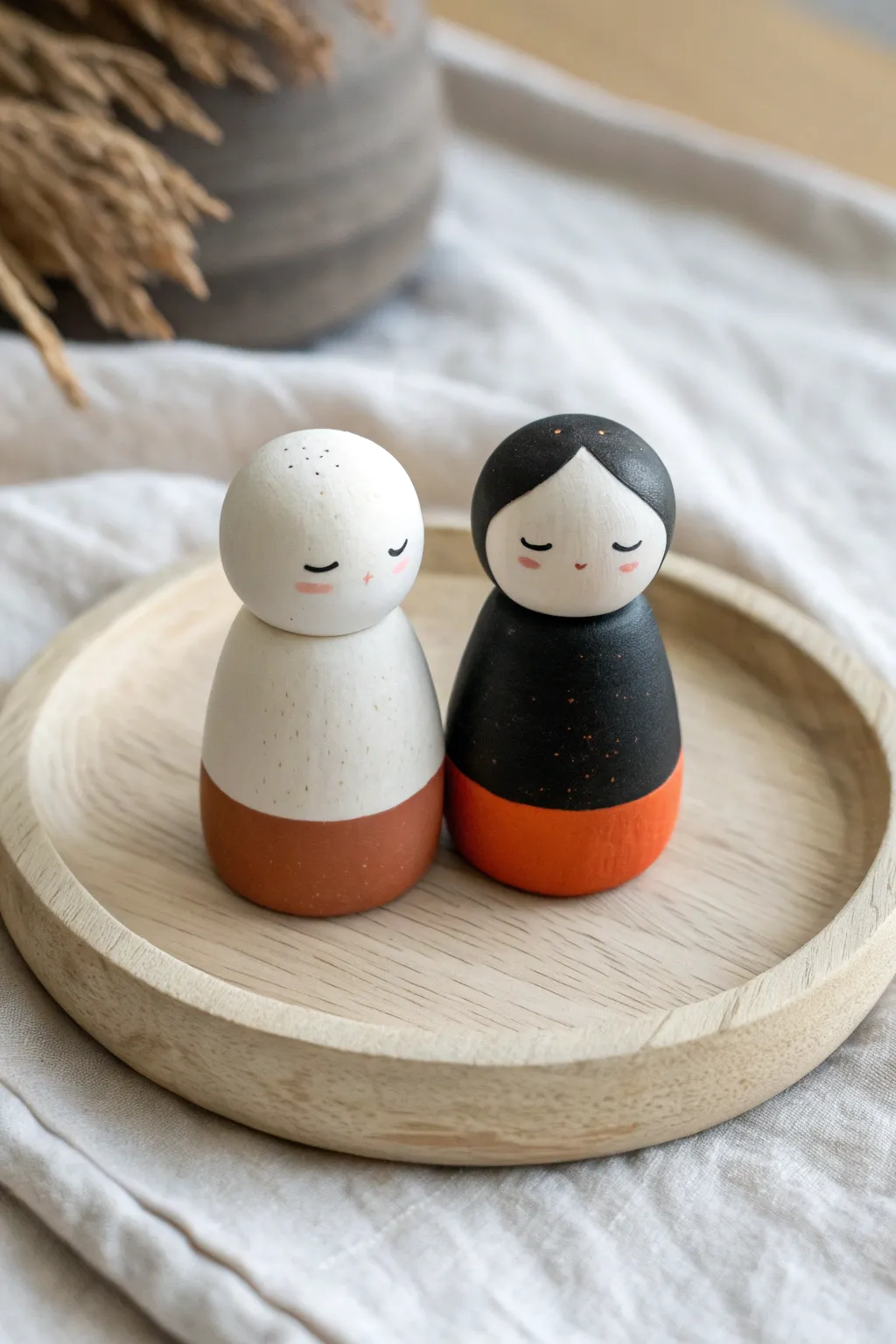 Limited-palette clay couple figurines in black, ivory, and coral for a cute date-night challenge