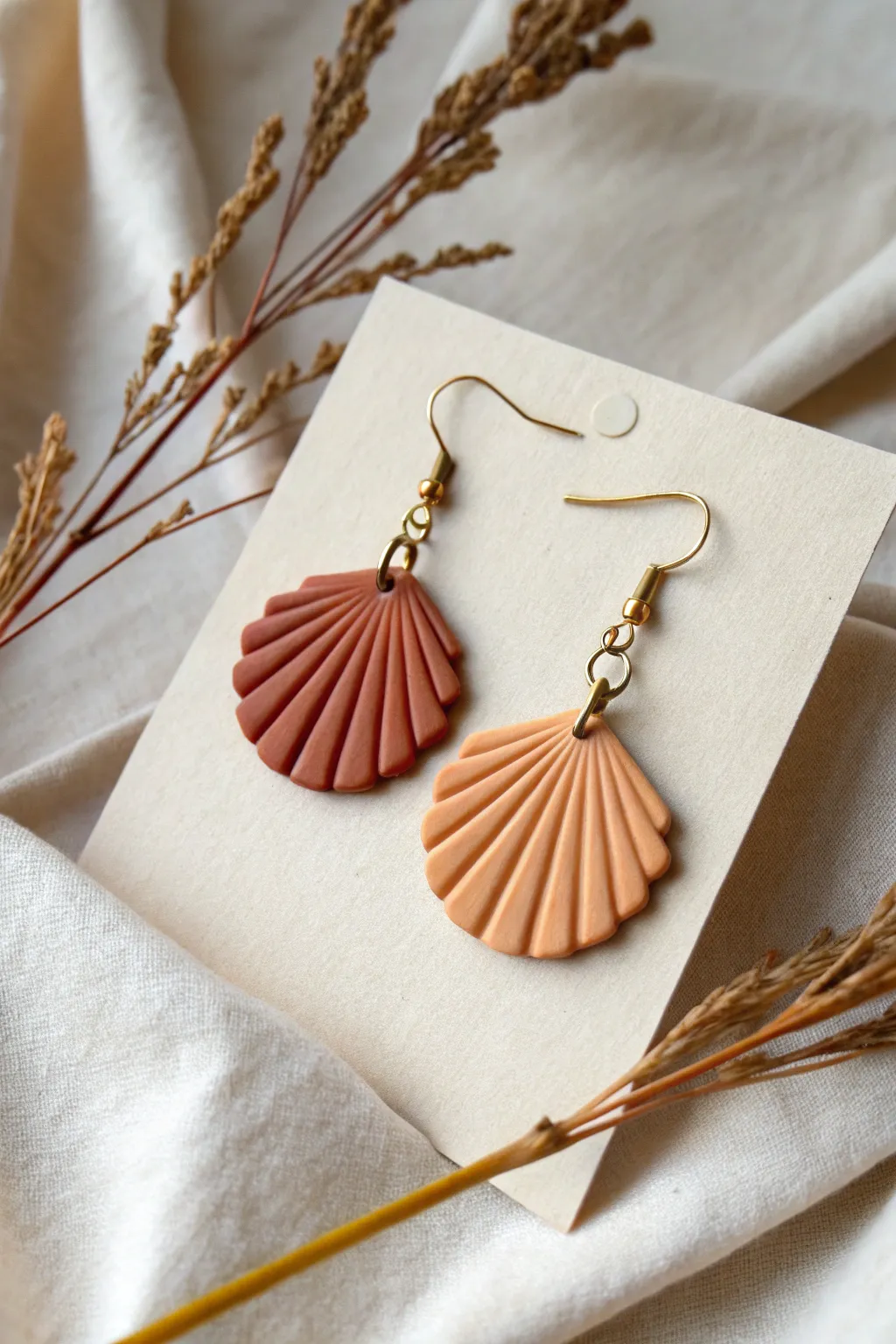 Minimal scalloped fan polymer clay earrings in warm neutrals, perfect beginner project inspiration.