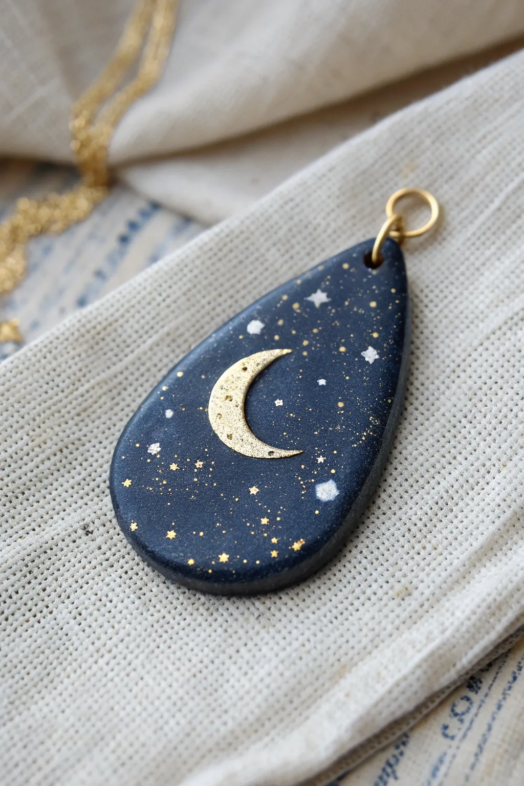 Night Sky Speckle polymer clay pendant in deep indigo with starry dots and a tiny crescent.