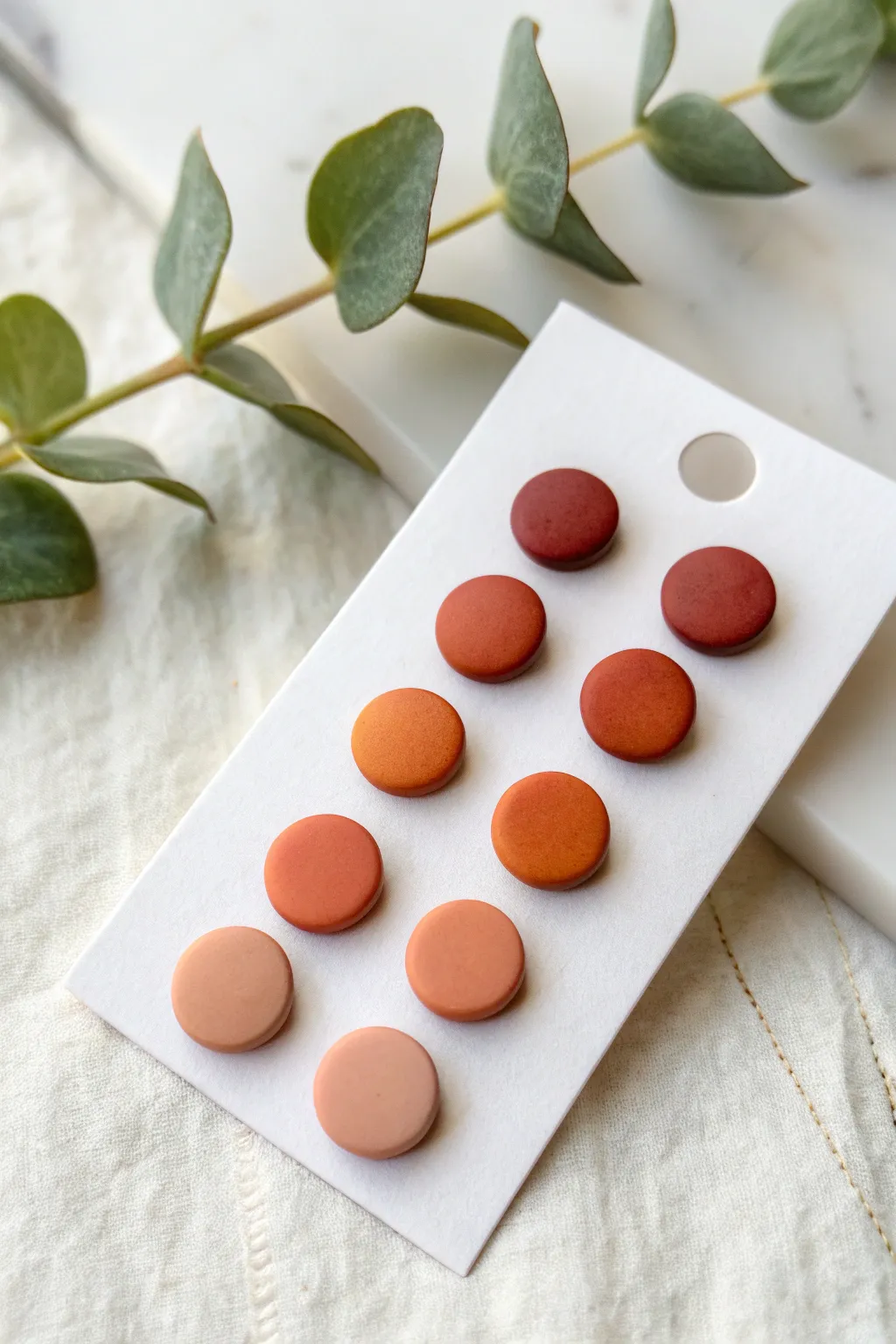Ombre polymer clay studs in a blush to rust gradient, minimalist, bold, and beautifully handmade.
