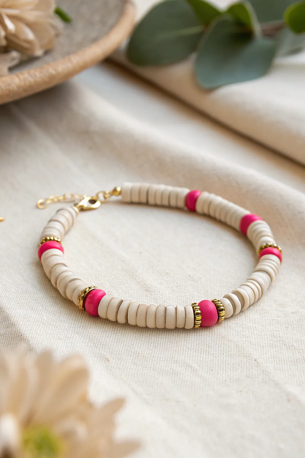 Neutral clay heishi bracelet with a bold pop stripe and tiny gold spacers for everyday preppy.