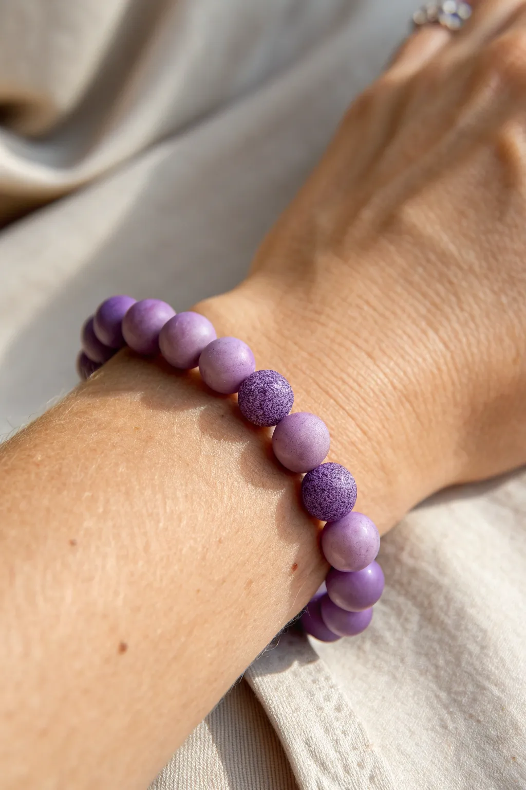 Matte and glossy purple clay beads side by side for a simple bracelet with rich texture contrast