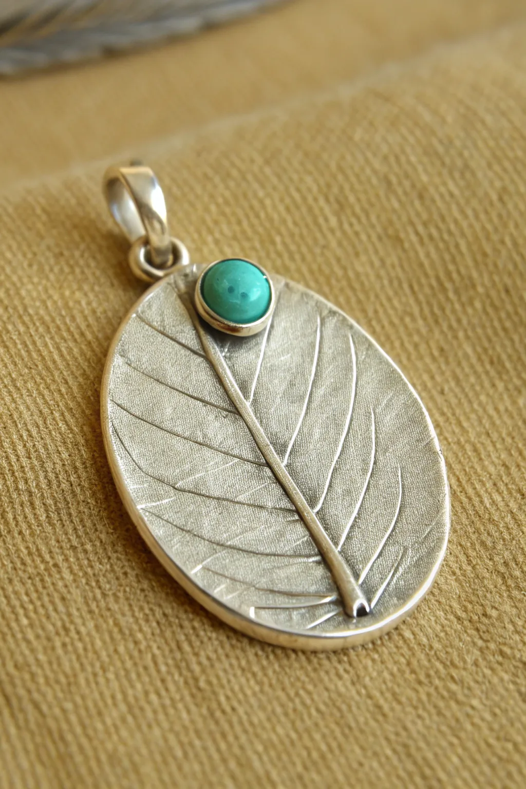Simple silver clay pendant with leafy texture and turquoise bezel accent for a beginner-friendly glow