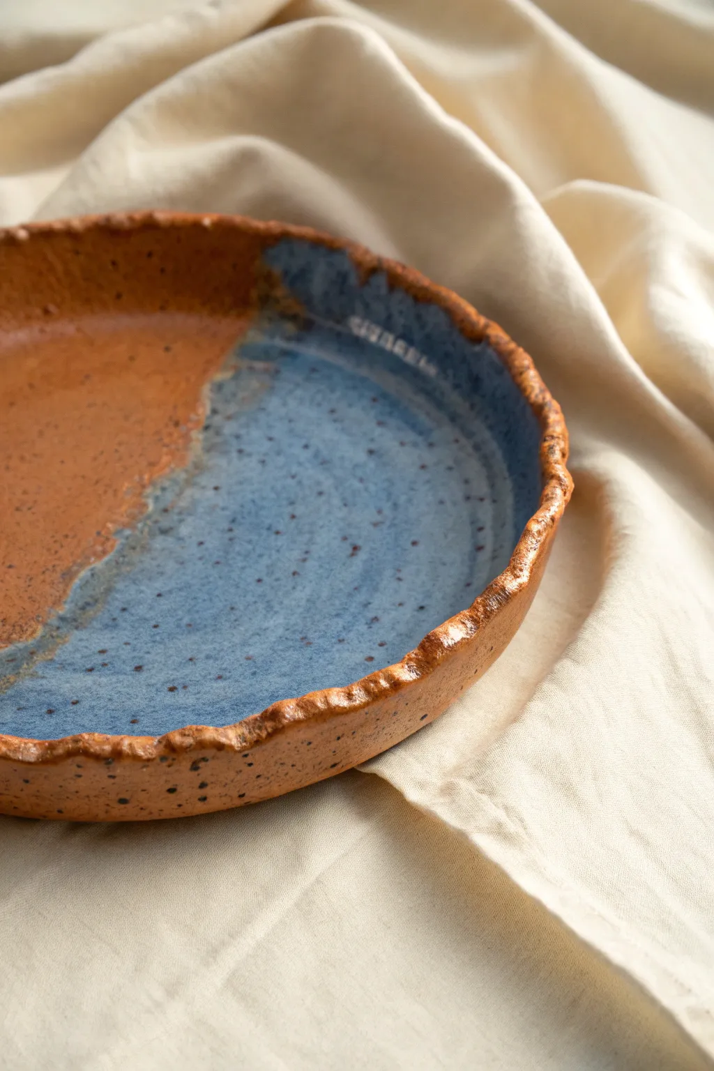 Organic torn-edge soft slab platter in a bold glaze, styled minimally for effortless Scandi-boho mood.