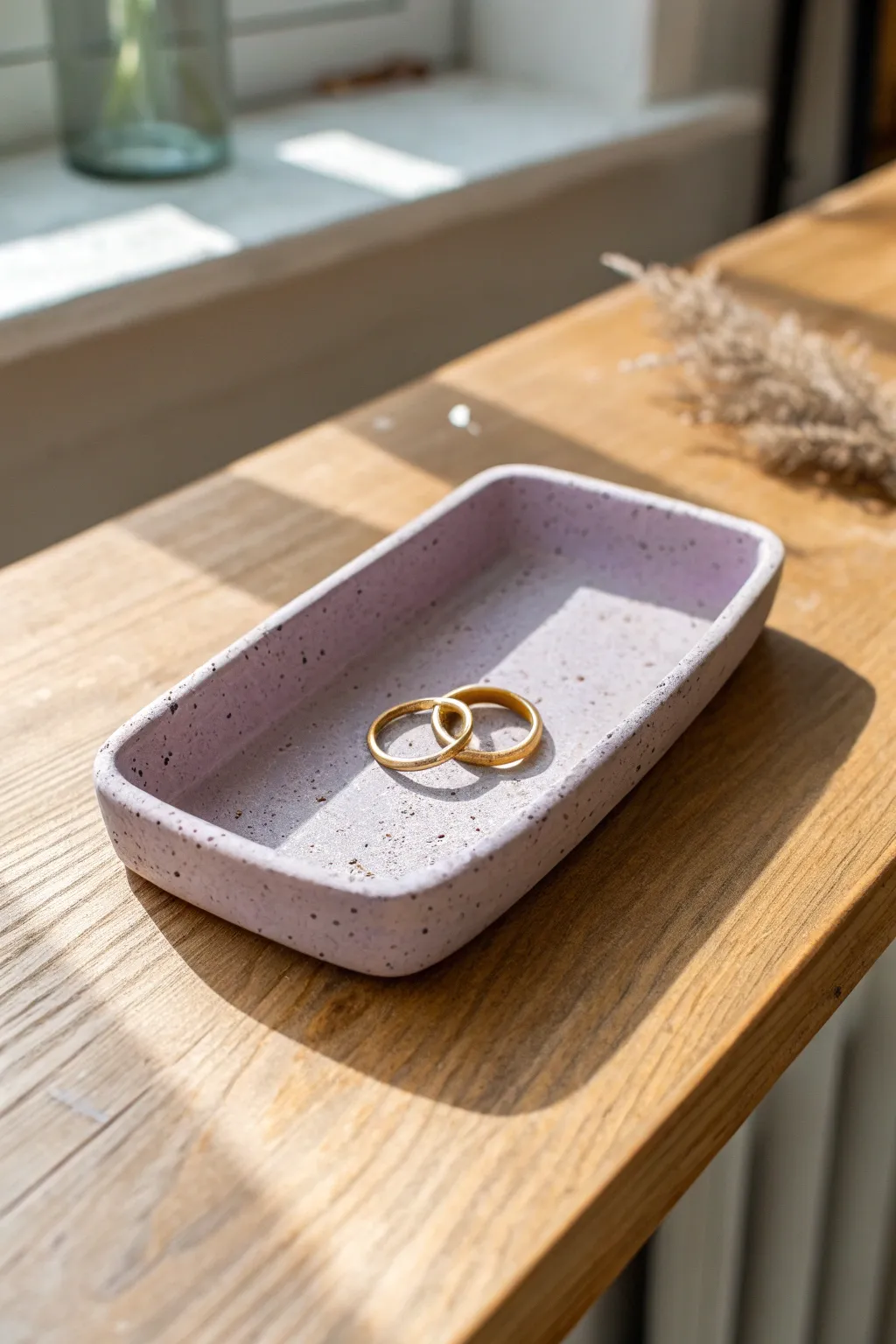 Coffin-shaped clay jewelry tray in dusty lavender, minimalist and spooky-chic for rings.