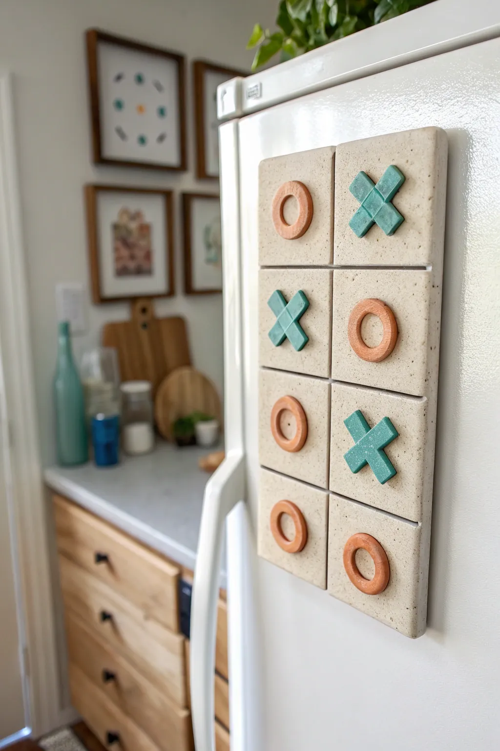 Magnetic clay tic tac toe set that doubles as chic fridge decor in bold, earthy tones.