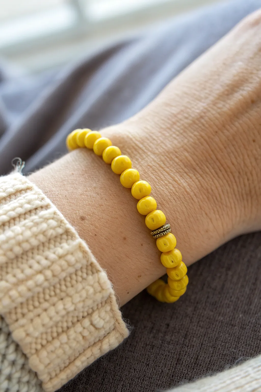 Sunny yellow heishi and round clay beads create a bouncy, stack-ready bracelet texture.