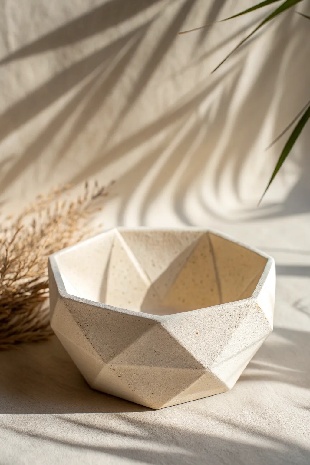 Faceted air dry clay bowl with crisp angles and soft light for a calm minimalist look