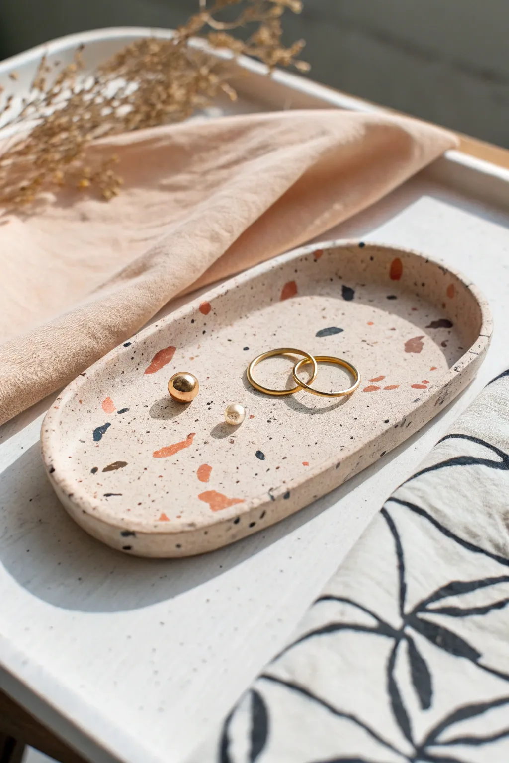 Speckled faux terrazzo air dry clay tray, a bright minimalist catchall that makes jewelry feel special.