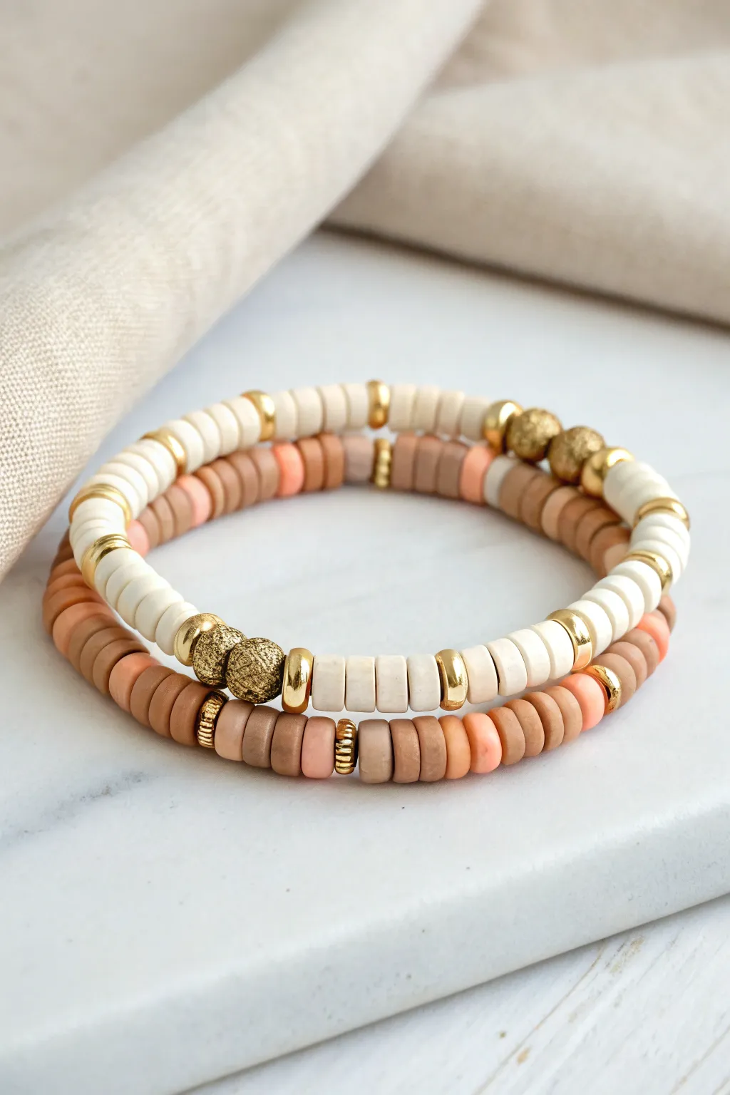 Double-strand heishi clay bead twist stack for a bolder, minimal boho everyday look