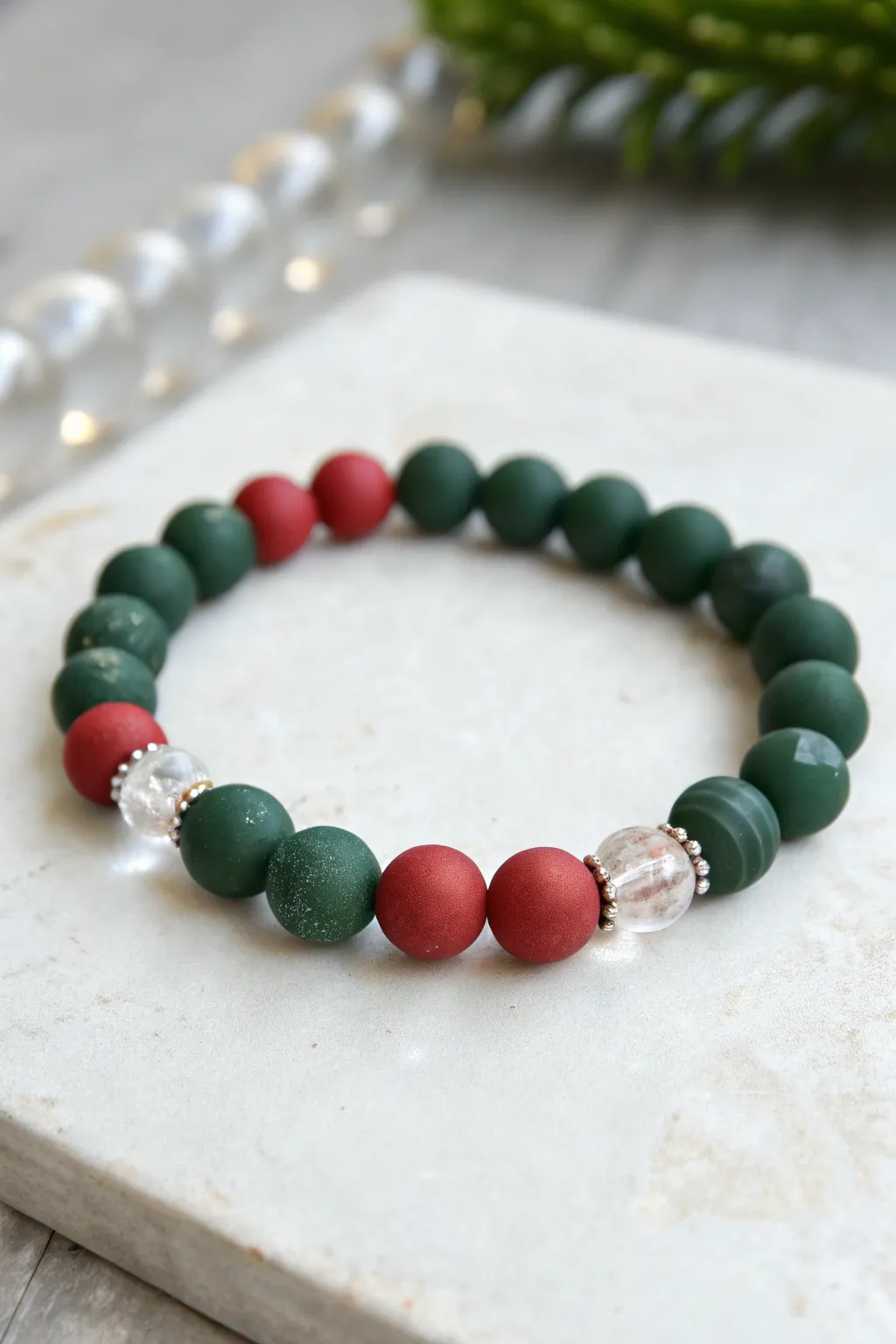 Red and green clay bead bracelet with icy crystal spacers for a clean, wintry Christmas look