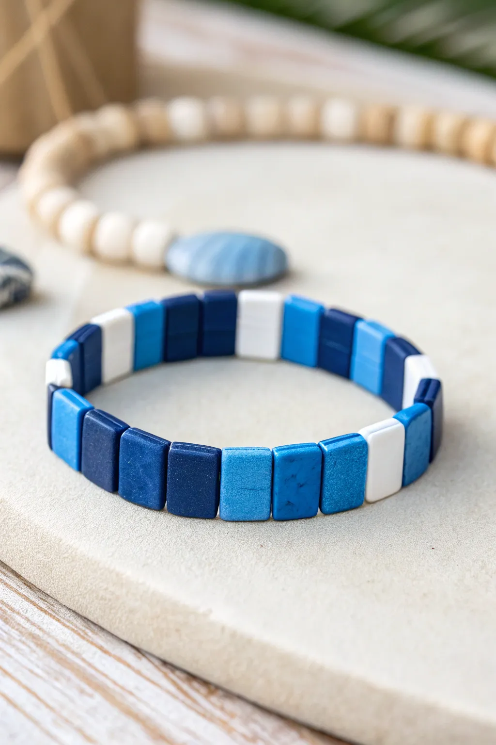 Blue mosaic clay bead bracelet with crisp white breaks, minimalist boho statement for sunny days.