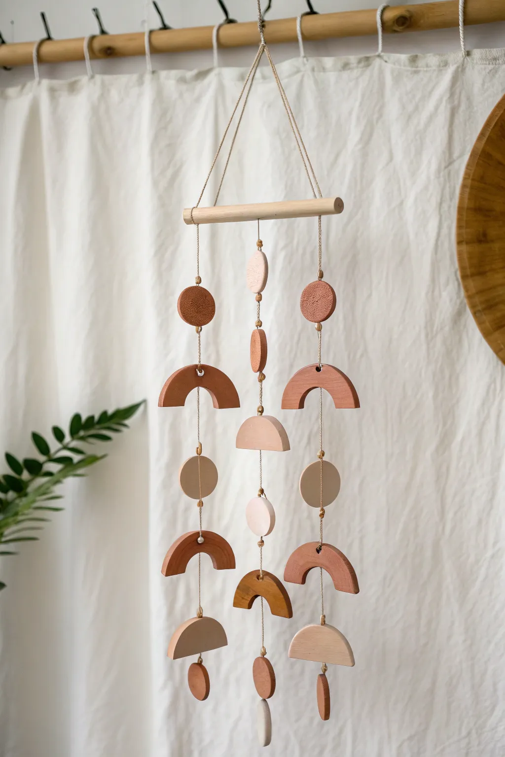 Easy boho clay mobile with simple shapes and soft tones, perfect for minimalist decor