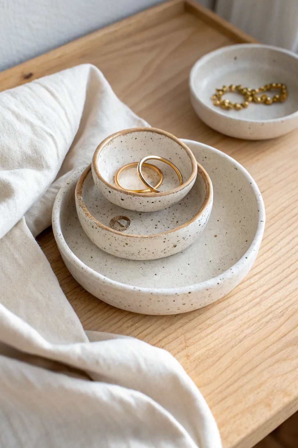 Stackable beaded trinket holders that keep rings and tiny treasures beautifully organized.